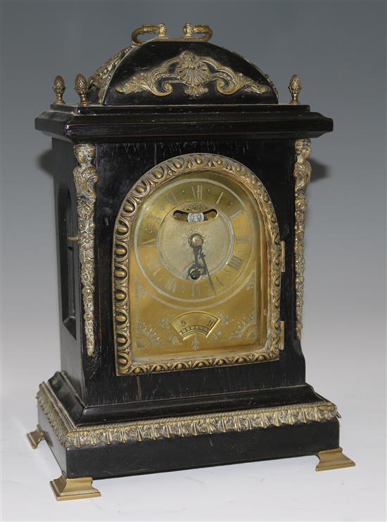 An ebonised calendar bracket clock, 38cms and wall bracket